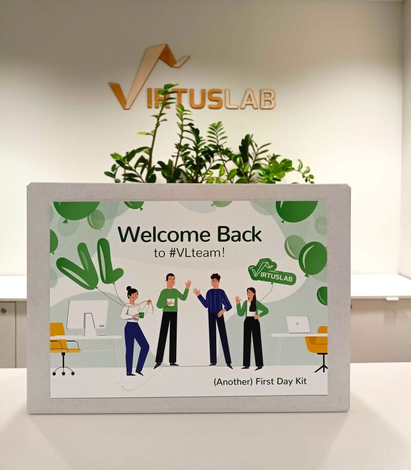 A returning VirtusLab employee receives an (Another) First Day Kit welcome pack that clearly nods to their reboarding | Gamfi Blog